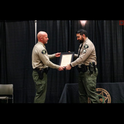 Mesa County Sheriff Todd Rowell presents award to Sergeant Ryan Morrison.