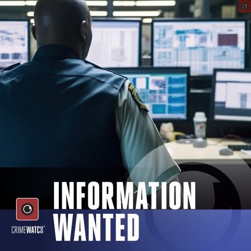 A man monitoring several computer screens and dashboards.